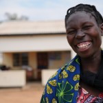 Audrey Shangala, a pregnant mother of three girls, waits outside the Nambala Rural Health Centre 